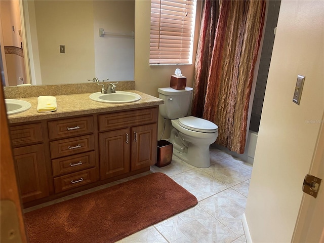 full bathroom with vanity, tile patterned floors, shower / bath combo with shower curtain, and toilet