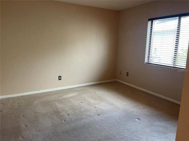 unfurnished room with carpet floors