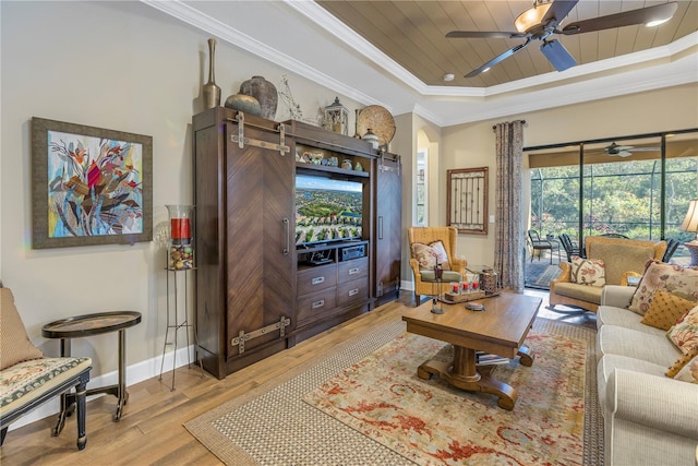 living room featuring light wood-type flooring, a tray ceiling, crown molding, and wood ceiling