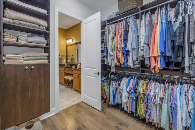 spacious closet featuring hardwood / wood-style floors