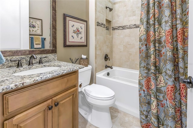 bathroom with tile patterned floors, vanity, and toilet