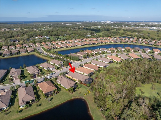 bird's eye view with a water view