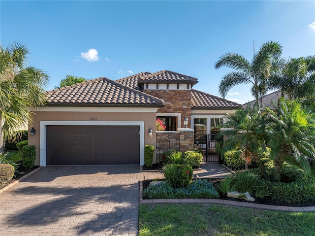 mediterranean / spanish-style home with a garage