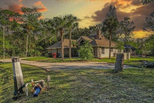 view of front of home with a yard