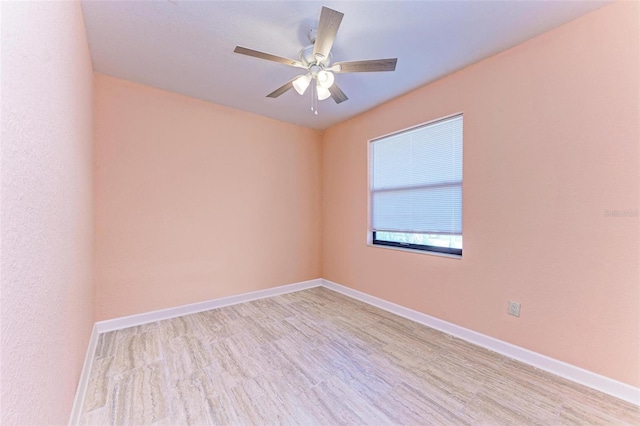 unfurnished room with ceiling fan and light hardwood / wood-style floors