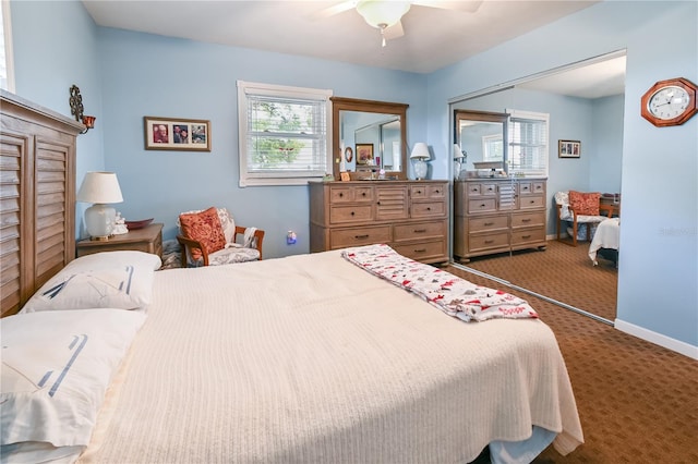 carpeted bedroom with ceiling fan and a closet