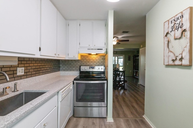 kitchen with white dishwasher, sink, wood-type flooring, white cabinets, and stainless steel range with electric cooktop