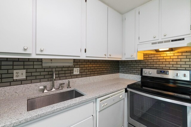 kitchen with dishwasher, white cabinets, sink, electric range, and tasteful backsplash