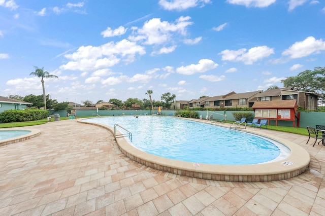 view of swimming pool featuring a patio