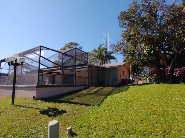 view of yard featuring a lanai