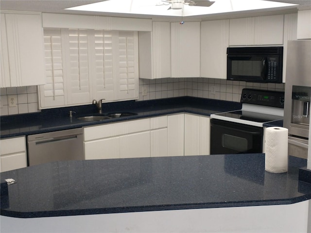 kitchen featuring range with electric cooktop, sink, stainless steel dishwasher, decorative backsplash, and white cabinets