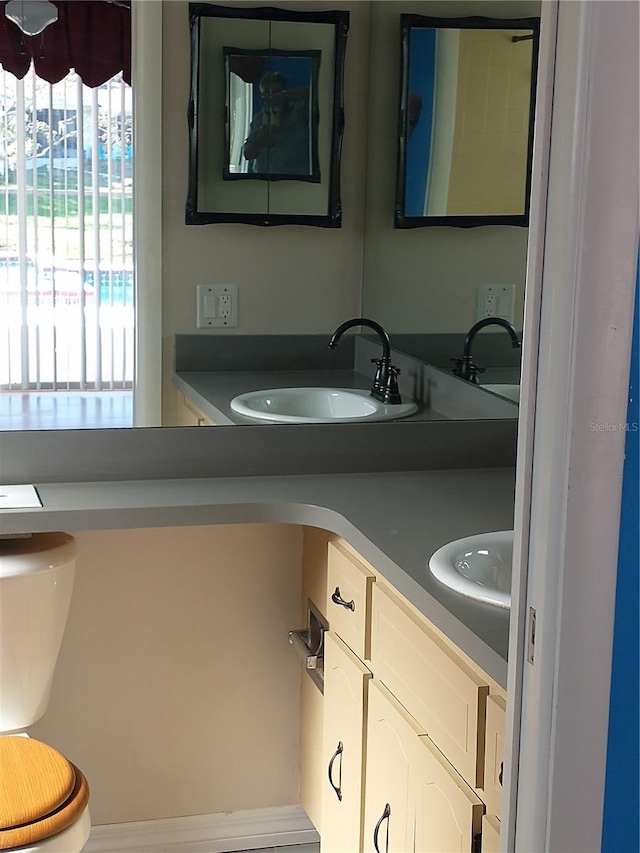 bathroom with vanity and toilet