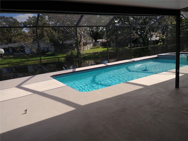 view of pool with a lanai and a patio area