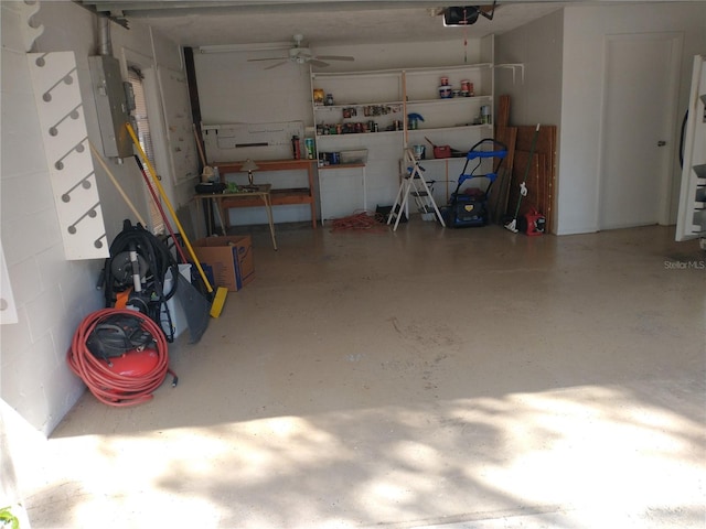 garage featuring a garage door opener and ceiling fan