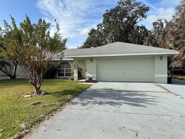 single story home with a front yard and a garage