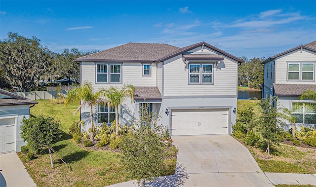 view of front of home featuring a front yard and a garage