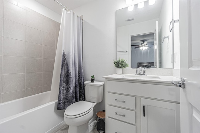 full bathroom with ceiling fan, toilet, shower / bath combo, and vanity