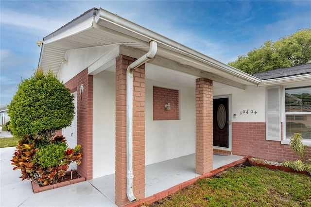 doorway to property with a porch