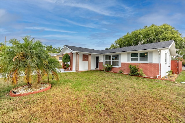 single story home featuring a front yard