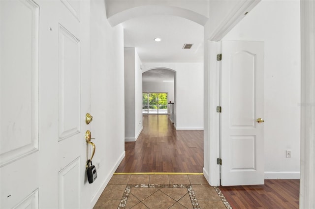 hall with dark wood-type flooring