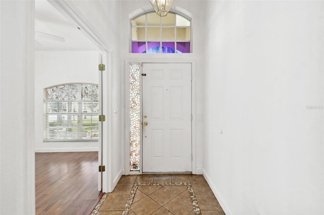 entryway with a chandelier and wood-type flooring