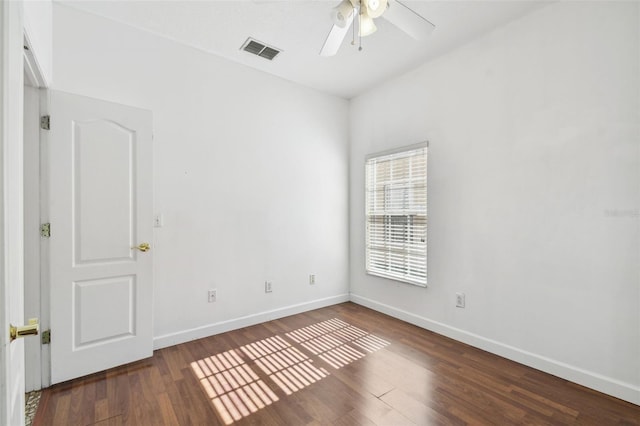 empty room featuring ceiling fan and dark hardwood / wood-style floors