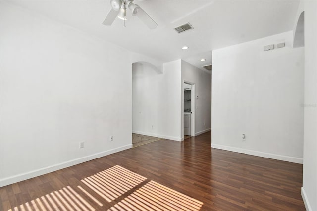 unfurnished room featuring ceiling fan and dark wood-type flooring