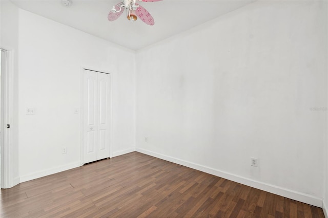 unfurnished room with ceiling fan and wood-type flooring