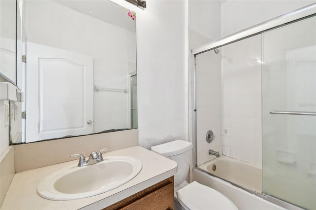 full bathroom with vanity, toilet, and enclosed tub / shower combo