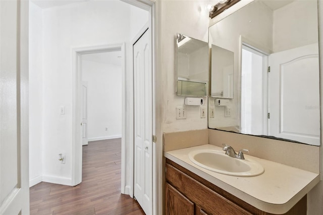 bathroom featuring vanity and hardwood / wood-style flooring