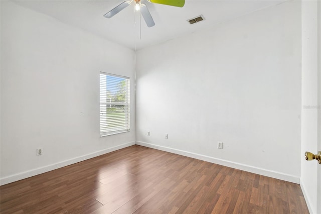 unfurnished room with ceiling fan and dark hardwood / wood-style floors