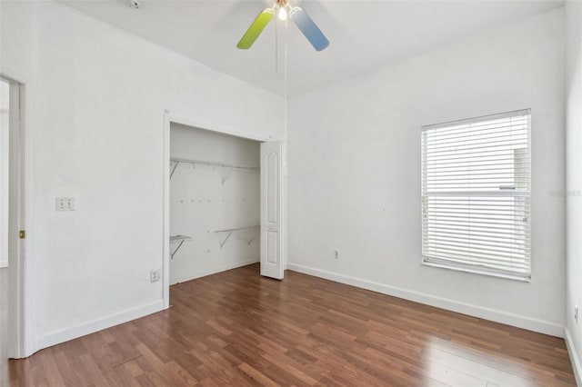 unfurnished bedroom with a closet, ceiling fan, and dark hardwood / wood-style flooring