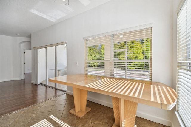 dining area featuring dark wood-type flooring