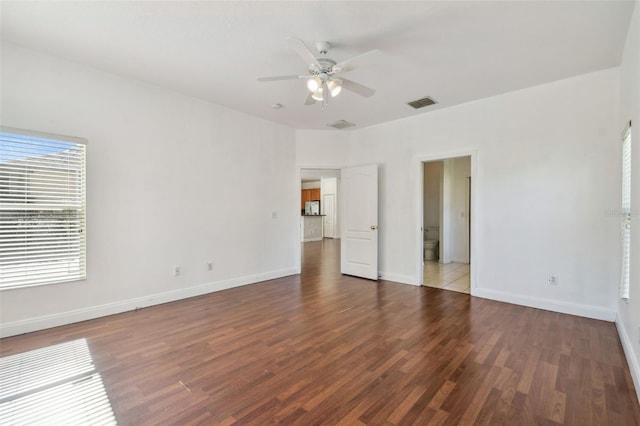 spare room with hardwood / wood-style flooring and ceiling fan