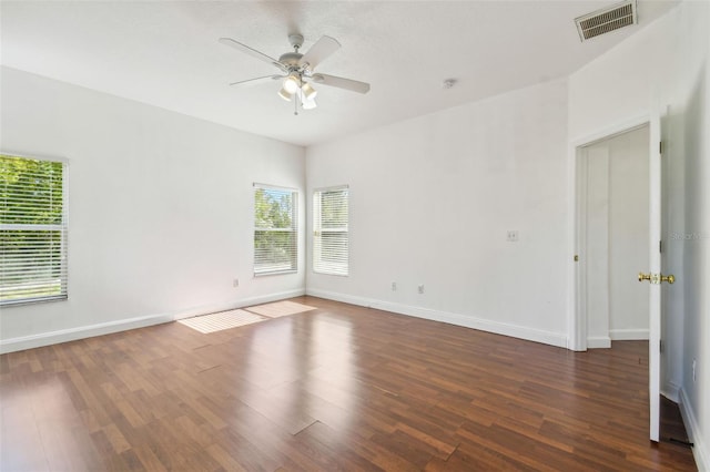 unfurnished room with ceiling fan and dark hardwood / wood-style floors