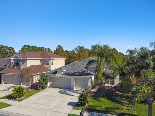 view of front facade featuring a garage and a front lawn