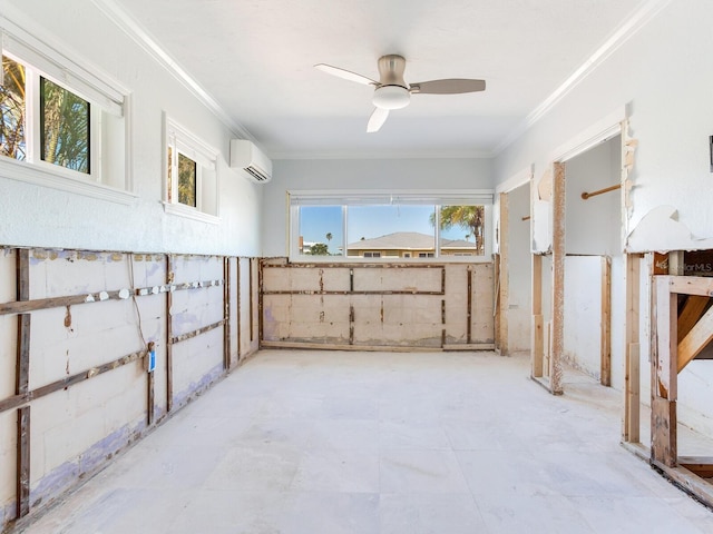 basement with crown molding, a wall mounted AC, a healthy amount of sunlight, and ceiling fan