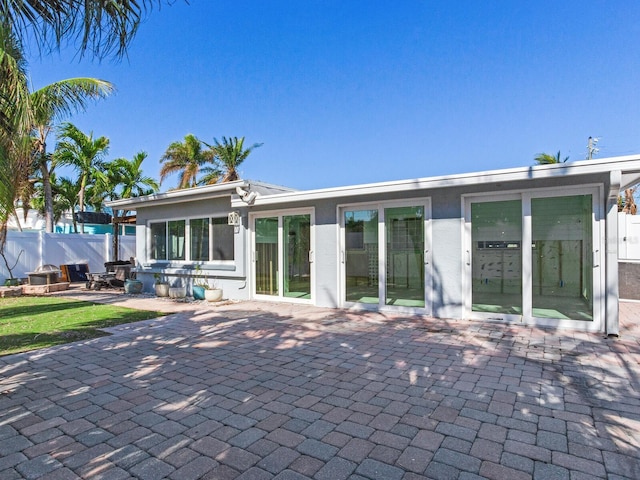 rear view of property with a patio area