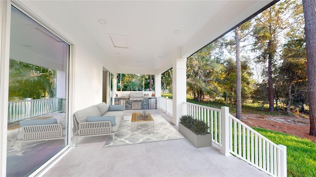 view of patio with an outdoor kitchen, an outdoor living space, and area for grilling