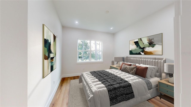 bedroom featuring recessed lighting, light wood-style flooring, and baseboards