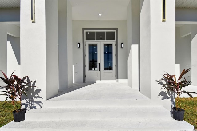 property entrance featuring french doors