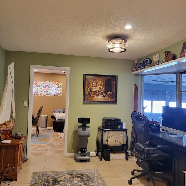 home office featuring light tile patterned floors and a textured ceiling