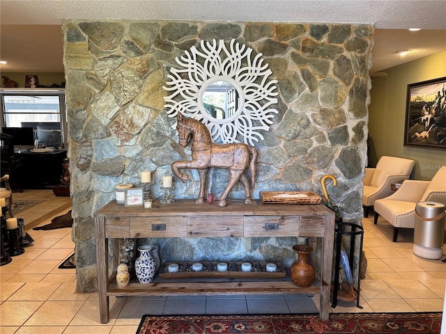 interior details with a fireplace and a textured ceiling