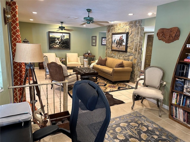 tiled living room with ceiling fan