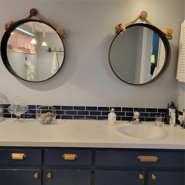 bathroom featuring backsplash and vanity