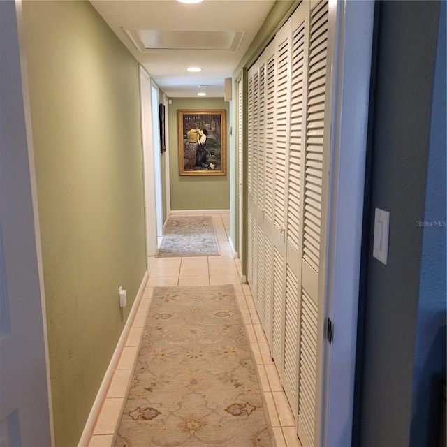 hall featuring light tile patterned floors