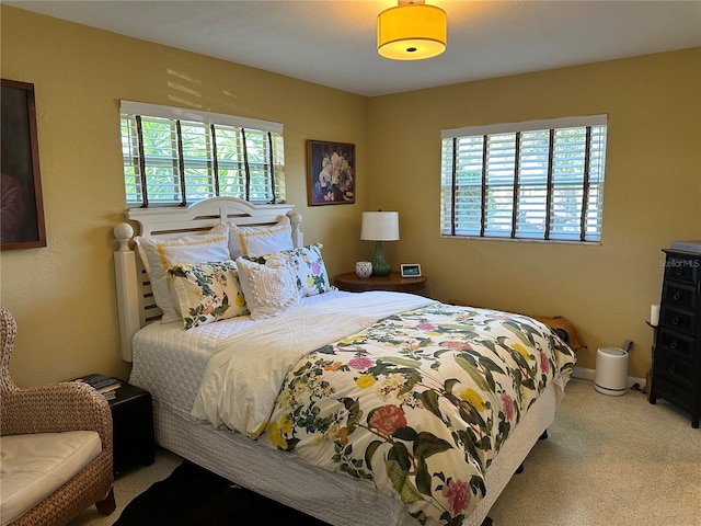 bedroom featuring light carpet