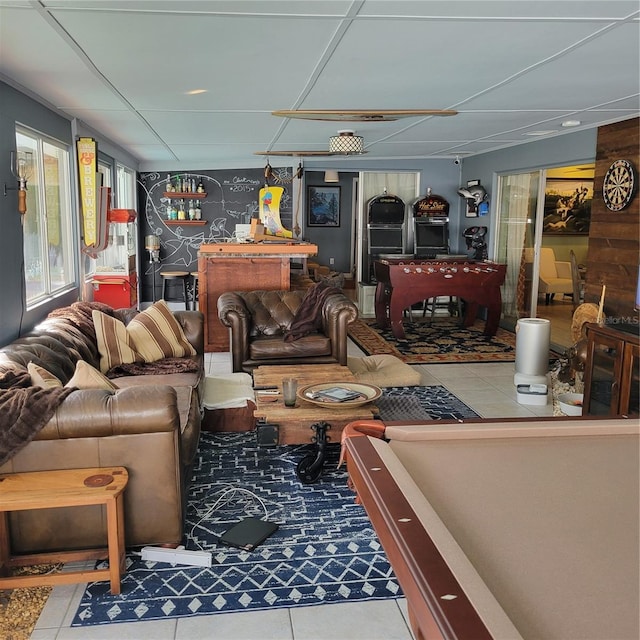 living room with light tile patterned flooring and billiards