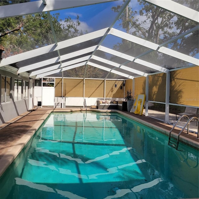 view of pool featuring a lanai and a patio area