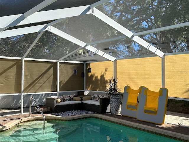 view of swimming pool with a patio area, glass enclosure, and an outdoor hangout area